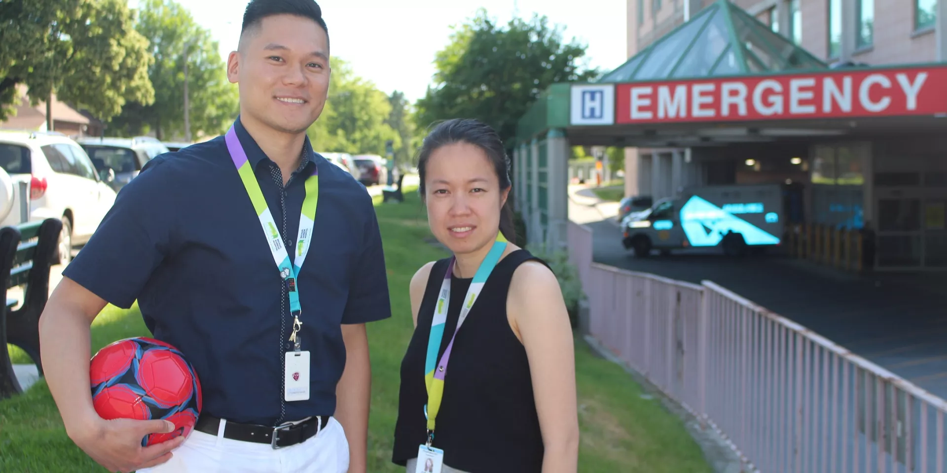 Andrew Liu, Clinical Manager, Pharmacy and Grace Ho, Pharmacist  Andrew Liu, Clinical Manager, Pharmacy and Grace Ho, Pharmacist pictured with a soccer ball outside the Michael Garron Hospital Emergency Department