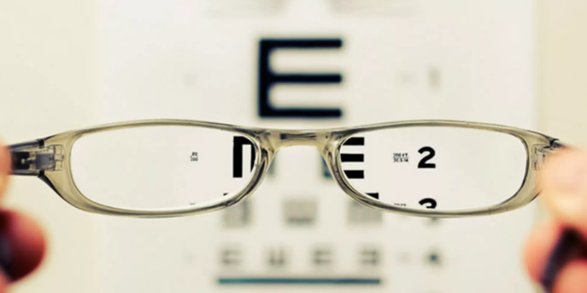 eyeglasses in front of eye chart  eyeglasses in front of eye chart
