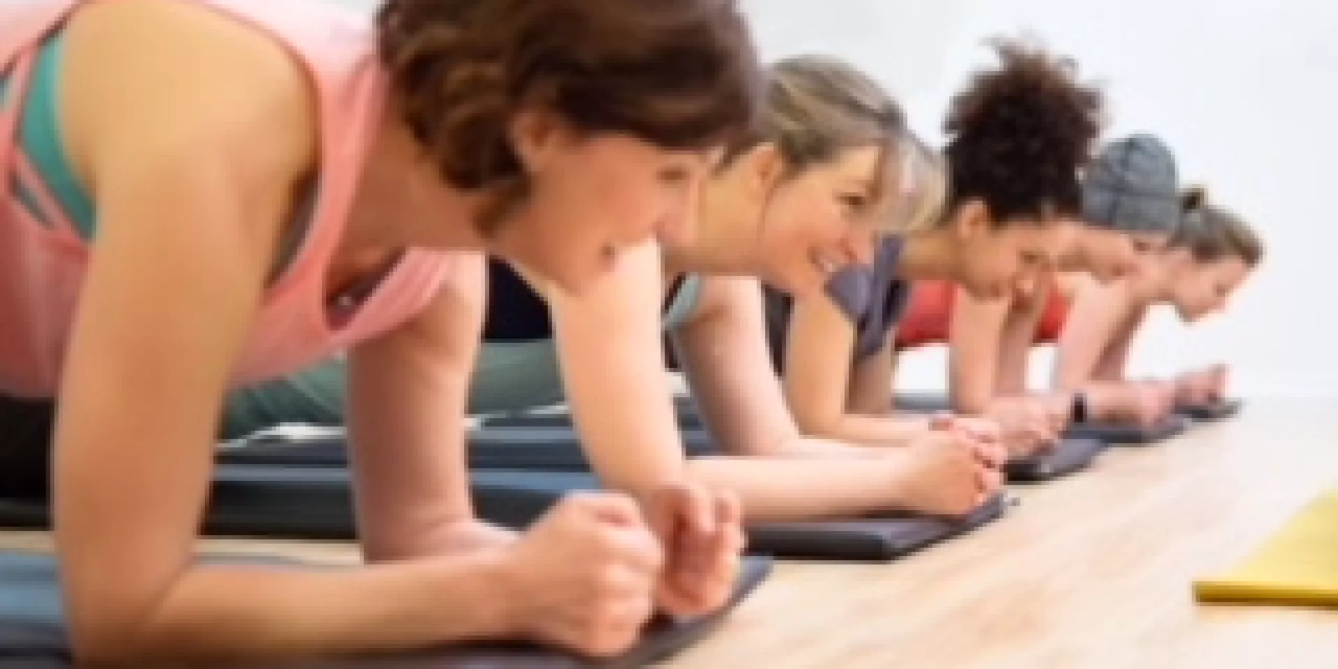 CareerFit Mom  several women in fitness class lying down on forearms