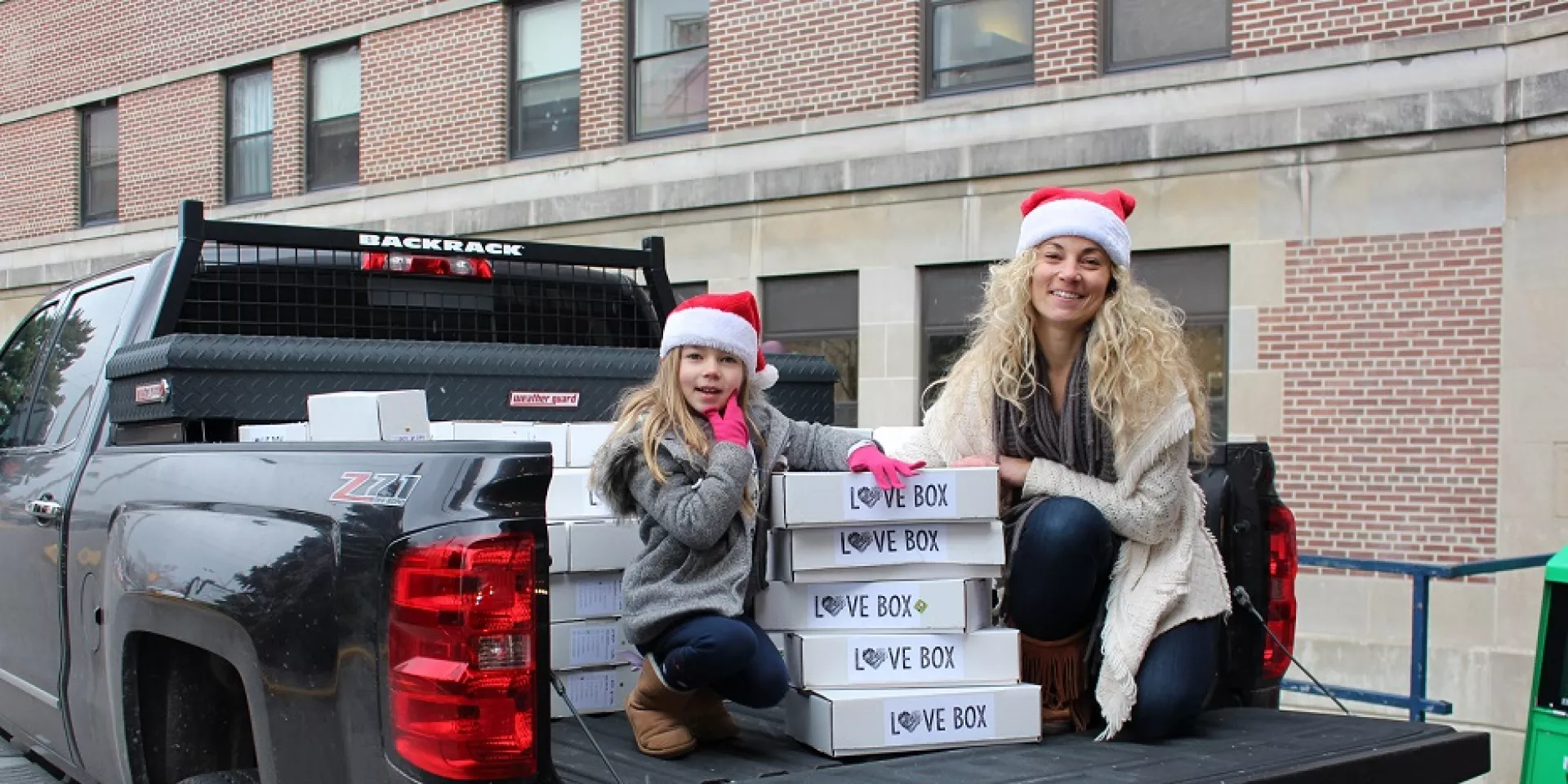 Impact Stories - Richelle Johnston and daughter Sydney deliver Love Boxes East Toronto resident Richelle Johnston and daughter Sydney, age six, unload Love Boxes at Michael Garron Hospital.