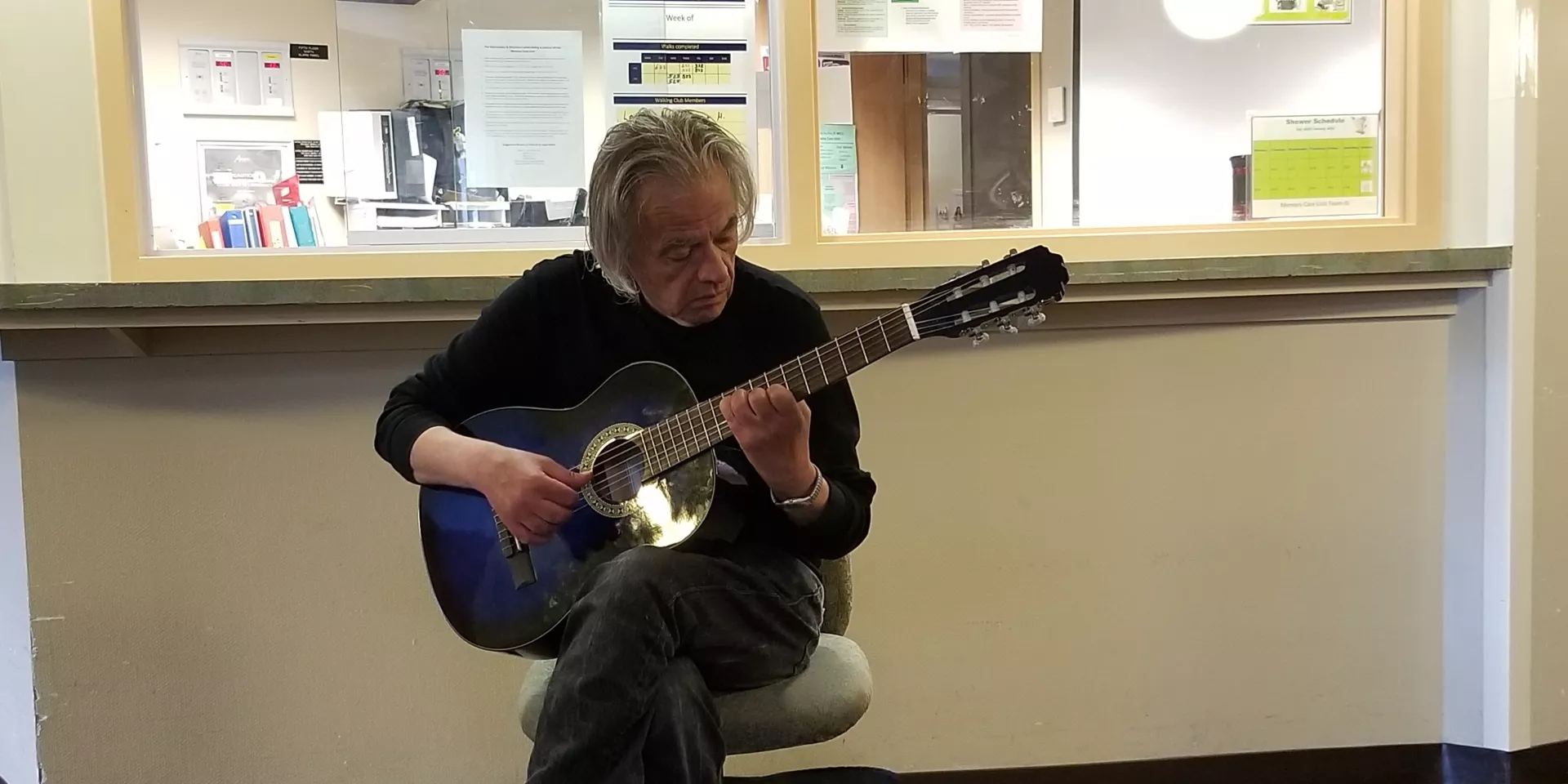 Michael Repoulis Man playing a guitar