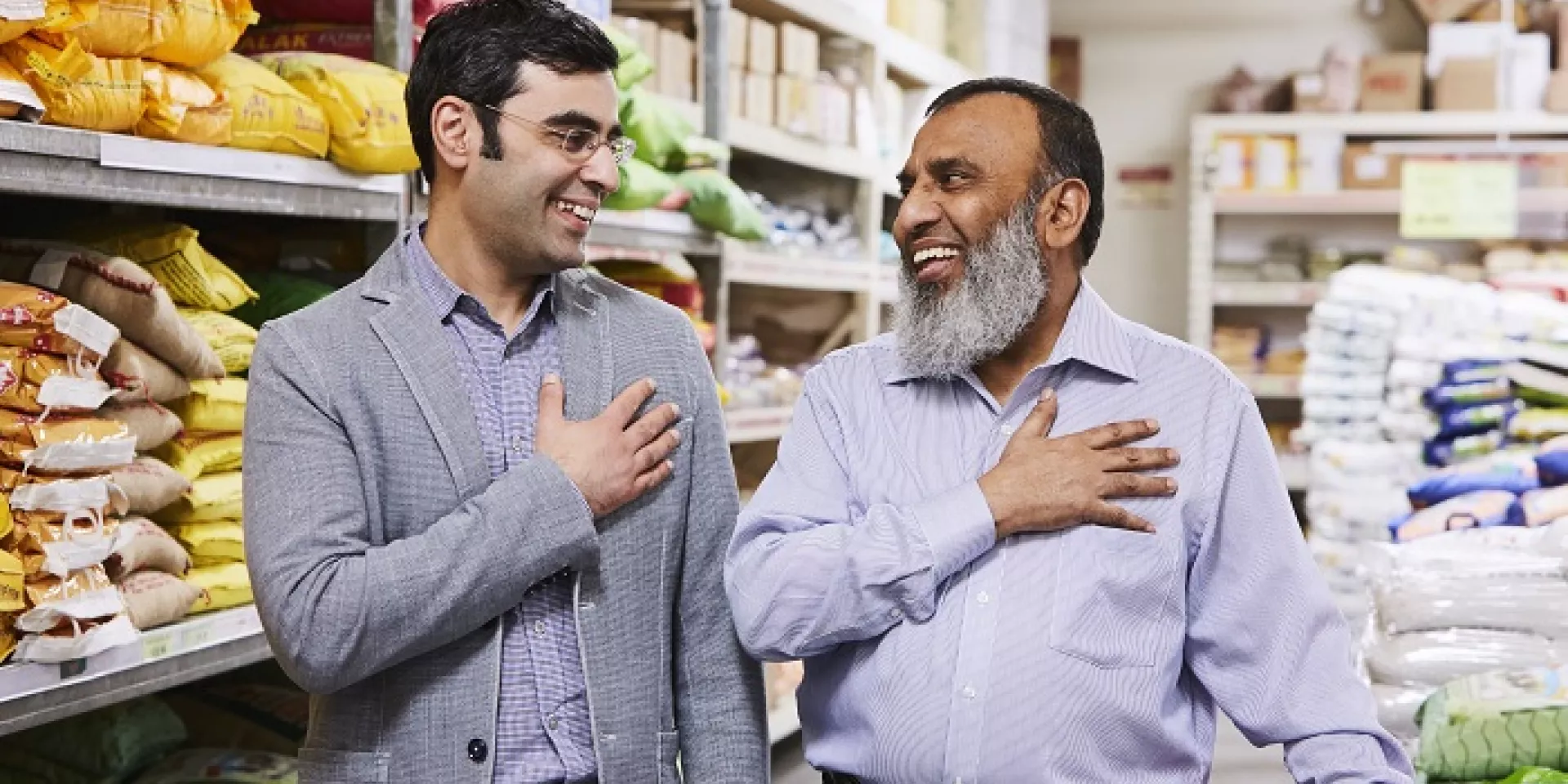 Iqbal Malek with Michael Garron Hospital Chief of Cardiology Dr. Mohammad “Mo” Zia two men standing side by side slightly turned to face each other each with right hand over heart