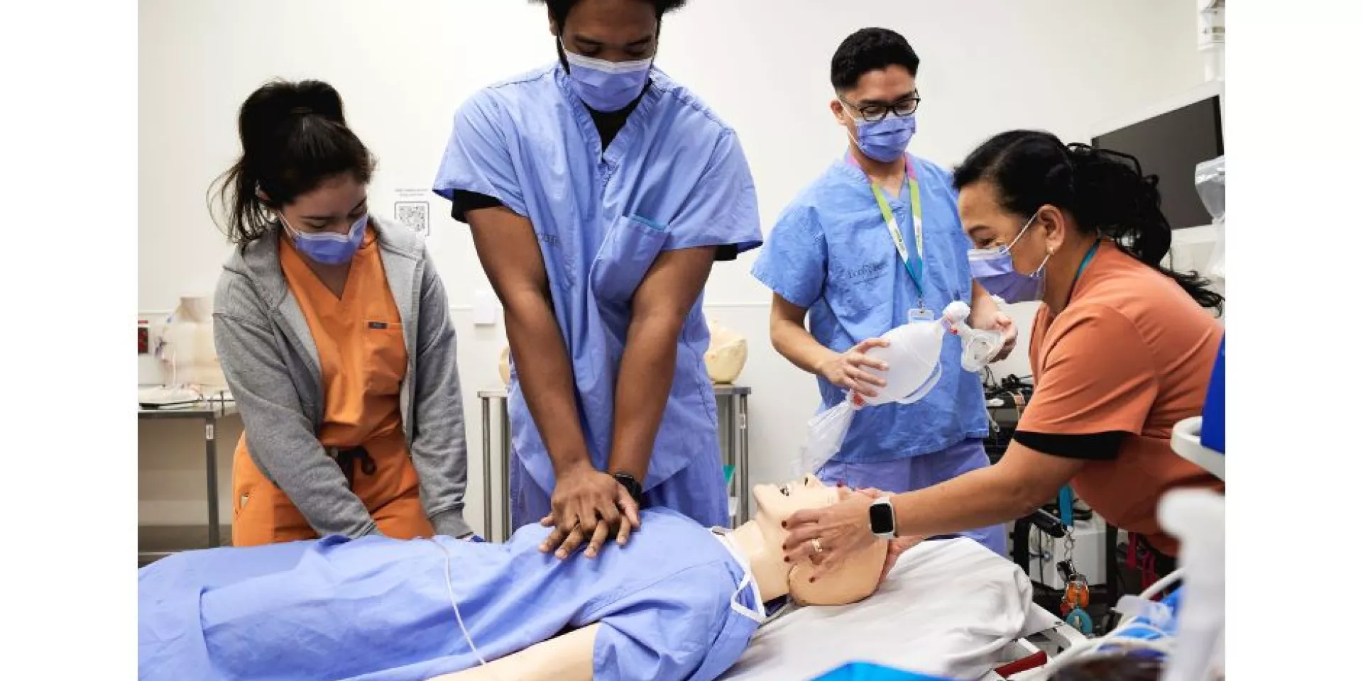 Practising a code blue scenario in the Rands Family Simulation Centre: Emma Kelly, RPN; Alexander Smith, RPN; Yuri Suico, Clinical Resource Lead, ED; and Sandra Millares, RN Practising a code blue scenario in the Rands Family Simulation Centre: Emma Kelly, RPN; Alexander Smith, RPN; Yuri Suico, Clinical Resource Lead, ED; and Sandra Millares, RN