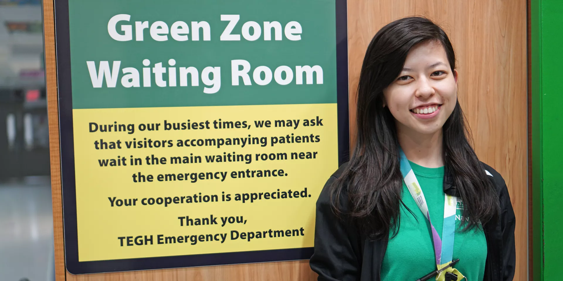 Dawn Lee, Emergency Department Navigator  Woman standing in front of sign