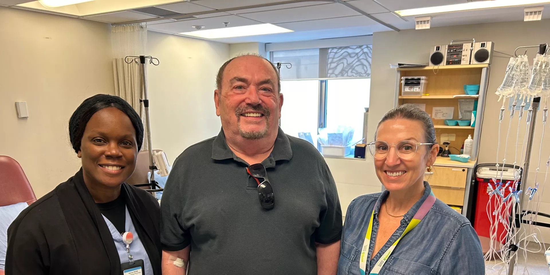 Dan stands with nurse Natasha Beason and haematologist Dr. Patricia Disperati 