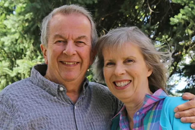 man and woman couple standing next to each other 