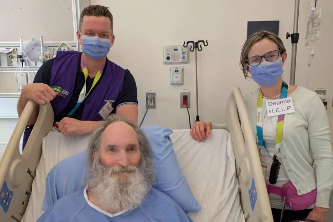 Robert enjoys visits from HELP team members, including Deanna Rosolen and HELP volunteer Dave Edwards.